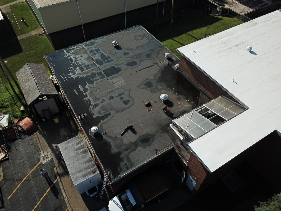 photo of roof from above with fresh roof application